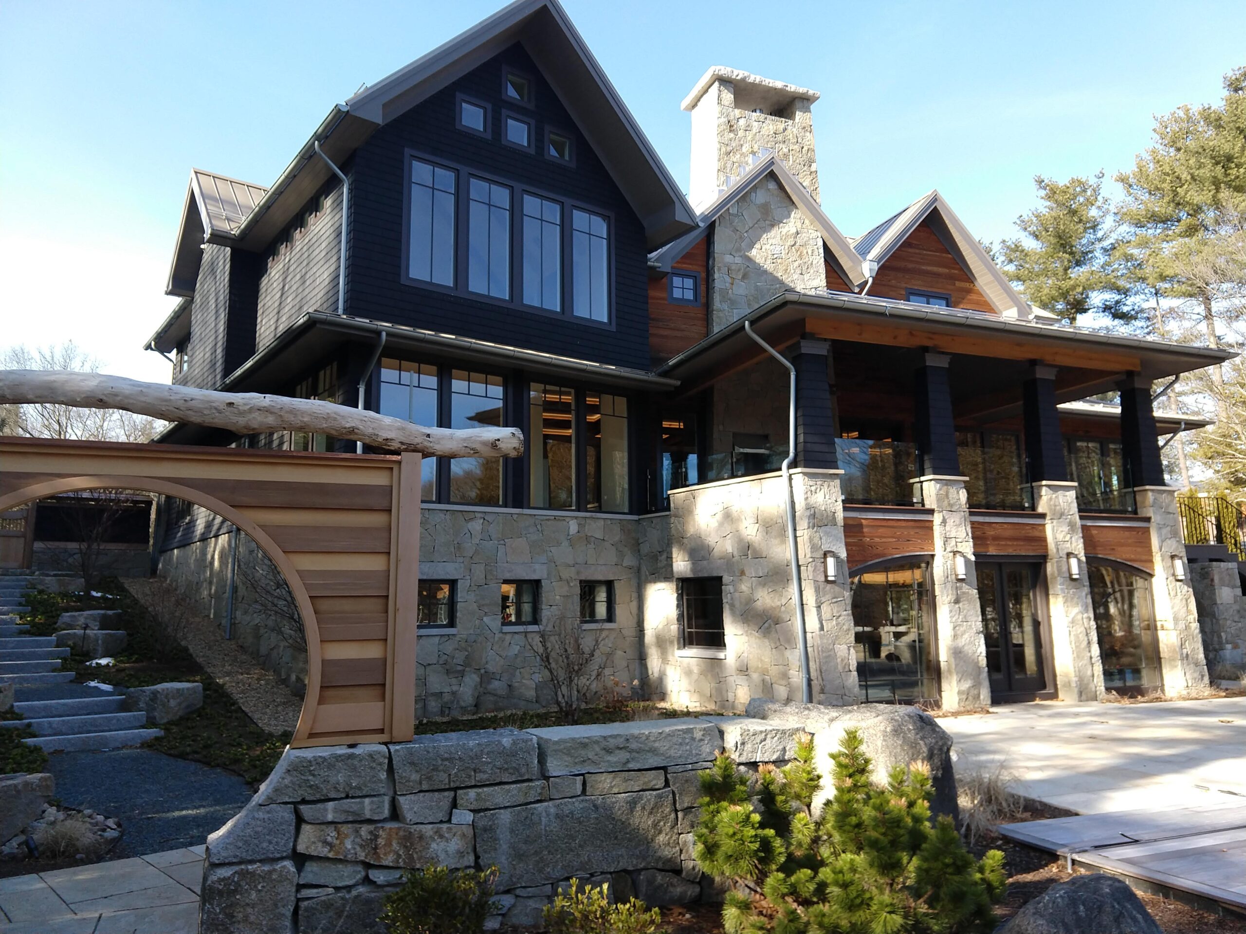 LT Farm Main House rear view looking through the moon-gate at the rear porch and back facade.